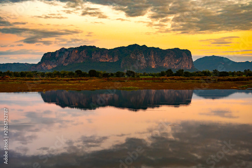 Beautiful sunset in Phu Pha Man  Khon Kean province  Thailand.Sunset with mountain above lake reflection in water.