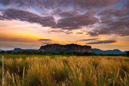 Beautiful sunset in Phu Pha Man  Khon Kean province  Thailand.Sunset with mountain above lake reflection in water.