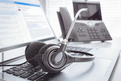 Headset headphones telephone and laptop in call center