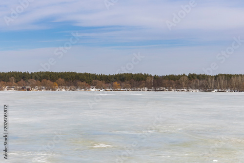 Frozen urban lake in spring