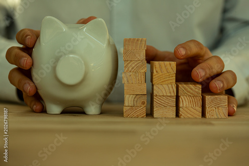 Hands arranging wooden bloc...