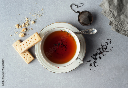 Directly above view of black tea served with buttery shortbread cookies