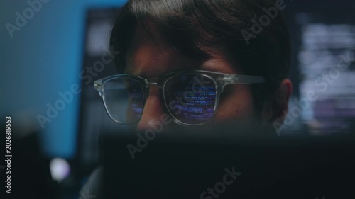 Software Engineer Face Glow with Digital Code Reflection on Spectacles