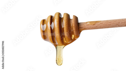 Foto Wooden honey dipper with golden viscous liquid dripping, isolated on transparent