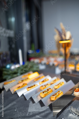 Modern Catering Setup With Canapes On Metal Trays
