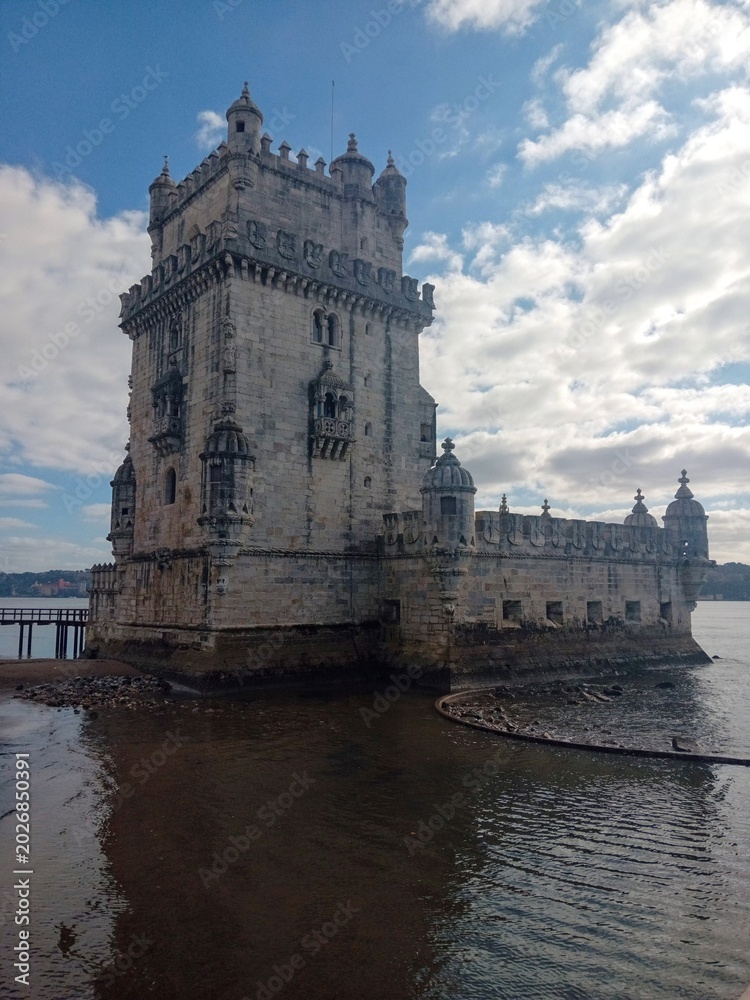Fototapeta premium Scenic view of the historic Belem Tower (Torre de Belem) on the Tagus River bank, Lisbon, Portugal.