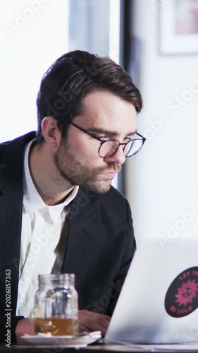 Working on AI prompts in a home office setting with a focused individual at a desk during daytime hours
