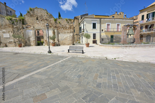 фотографія Vasto town square featuring ancient stone entrance and bell structure