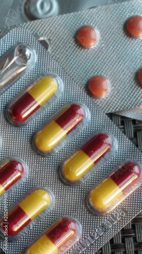 Cough and headache as symptoms of a cold or other respiratory illness. Treatment for the virus with tablets and capsules containing medication. Vitamins and immune system support. World medicine.