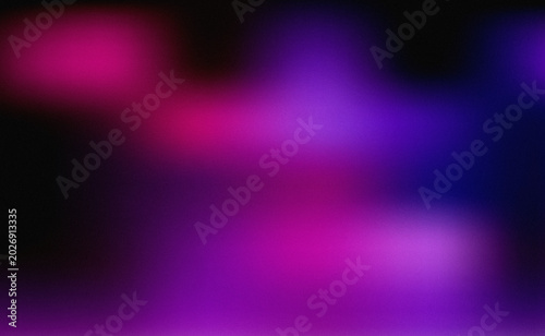 Abstract grainy gradient background with dark canvas and blurred pink magenta and purple lights