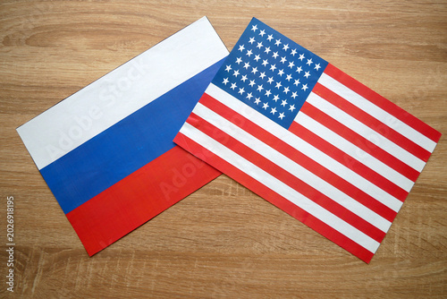 Russian and American Flags on Table. Russia USA Diplomatic Relations Concept.