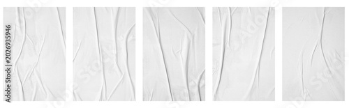 white crumpled and creased glued mockup paper poster template set isolated on black background