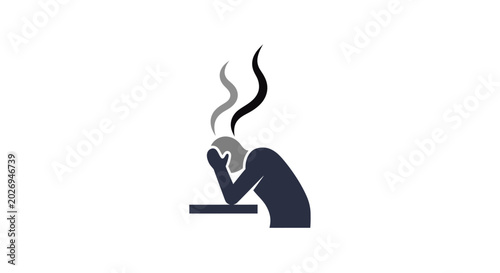 A person sitting at a desk feeling stressed.