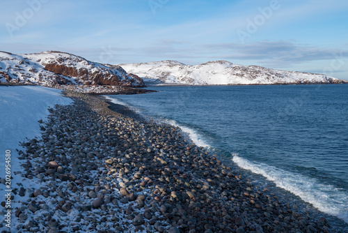 Dragon Egg Beach on a March day. Barents Sea coast. Murmansk region, Russia