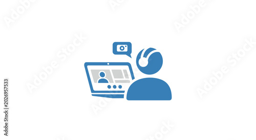 A person interacting with a laptop and a camera.