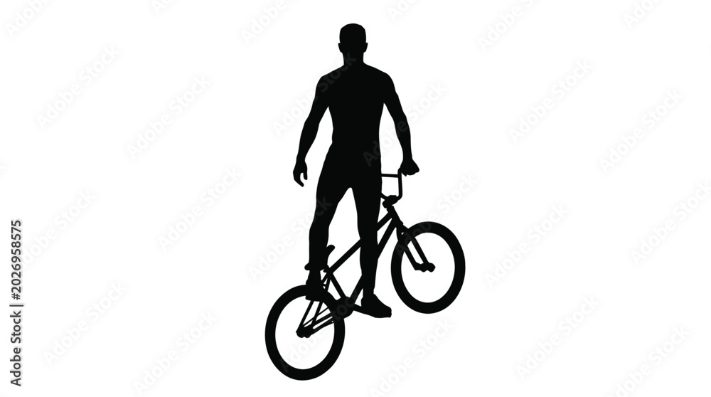 Fototapeta premium Silhouette of a young man performing a stylish trick on his bmx bicycle in this photo