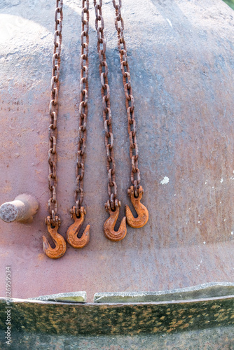 Old rusted metal hook and chain