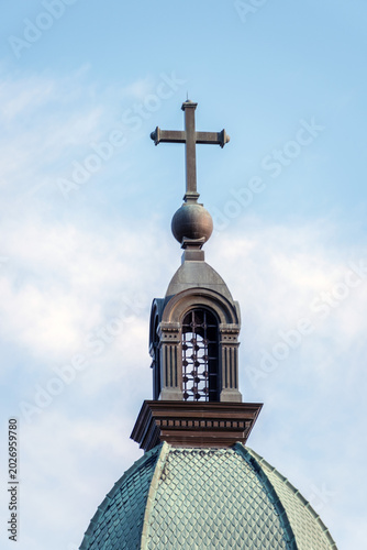 A cross on top of a church tower