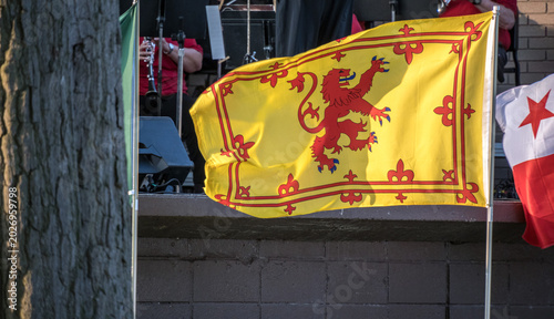 A foreign flag flying in the wind.