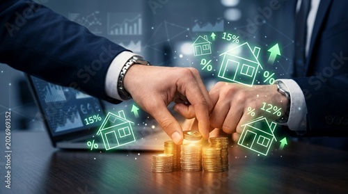 Businessman stacking gold coins for real estate investment growth