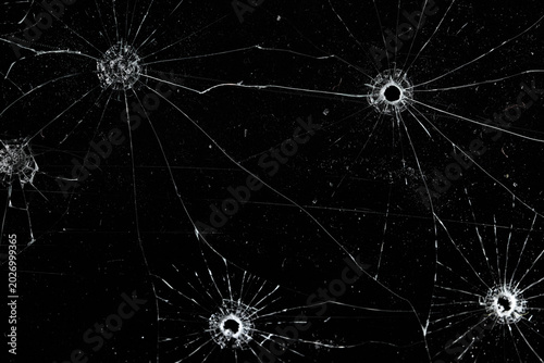 Bullet holes on black glass, overlay design background