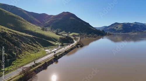 Fotografija Aerial View of Lake Forsyth and Road Beside Green Hills