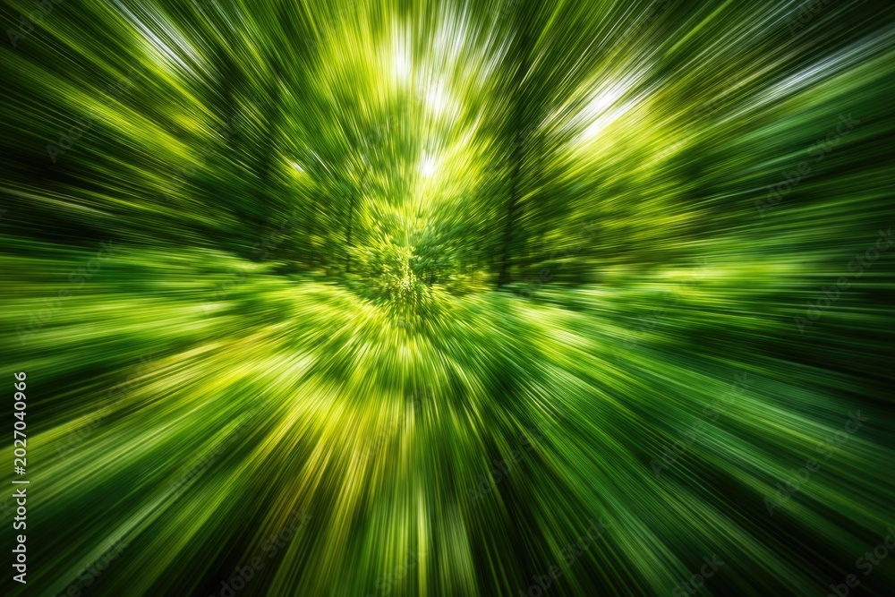 Obraz premium Vibrant green abstract backdrop with motion blur simulating fast nature movement