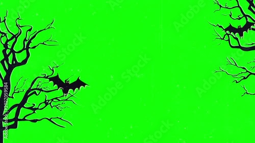 Animated silhouettes of bats flying around bare haunted trees on a bright green screen background for halloween video editing and motion graphics compositing