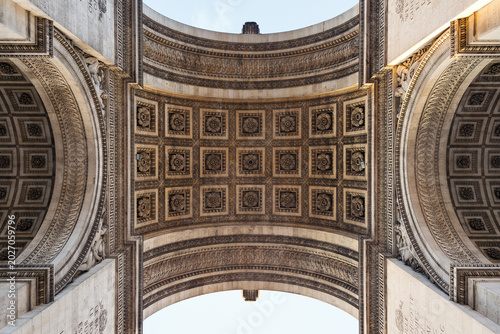 View of the intricate coffered ceiling and ornate stone carvings of the Arc de Triomphe, Paris, Ile-de-France, France.
