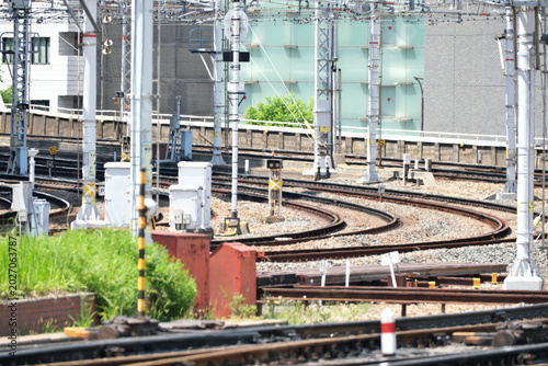 Fotografie Scenery of railway tracks leading to the future through the hustle and bustle of