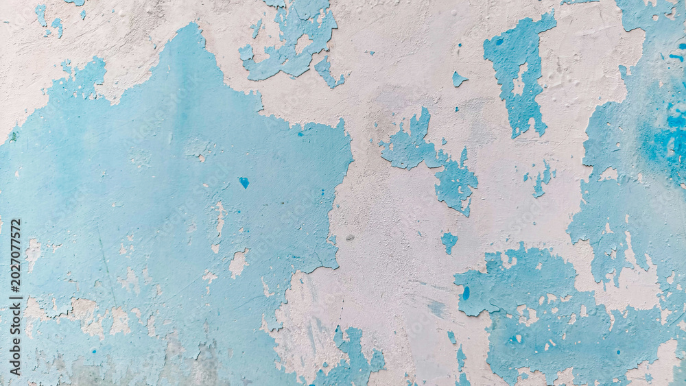 Fototapeta premium Peeling Light Blue Wall Paint Texture with Weathered Cracked Surface for Grunge Background and Vintage Design