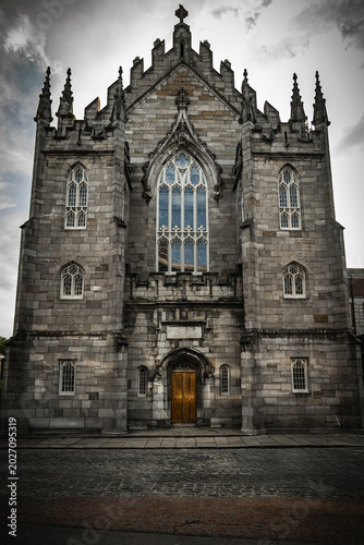 Photography A large historic church built from stone, showcasing Gothic-style architecture with pointed arches, towers, and detailed masonry