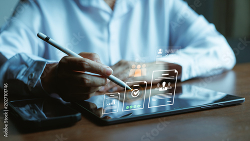 Foto Professional using stylus on tablet for paperless digital operations with virtual document workflow, approval, and secure business management interface