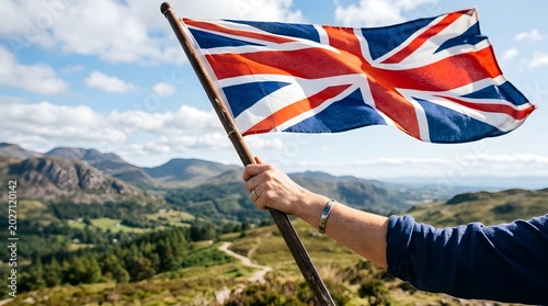 United kingdom flag waving over scenic mountain landscape england