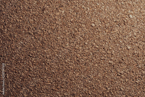 Closeup of organic brown cork board sheet surface. Textured abstract background for eco friendly branding corporate notice board and interior design concepts