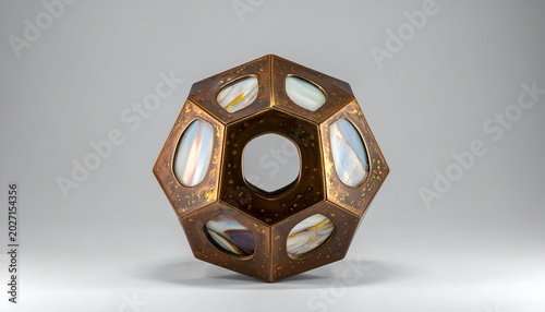 Geometric sculpture; bronze frame, opalescent glass panes, with a center hole