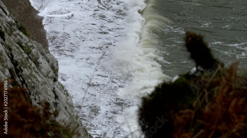 Sea waves breaks on the shore. Irish sea. Super Slow motion 4K