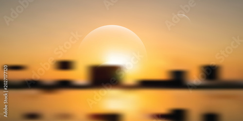 Photos Blurred sunset over city skyline with warm golden hues and soft focus