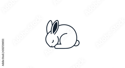 Billede på lærred Cute rabbit sitting down sleeping.