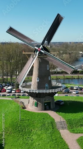 Traditional Dutch windmill in a rural countryside landscape in Europe