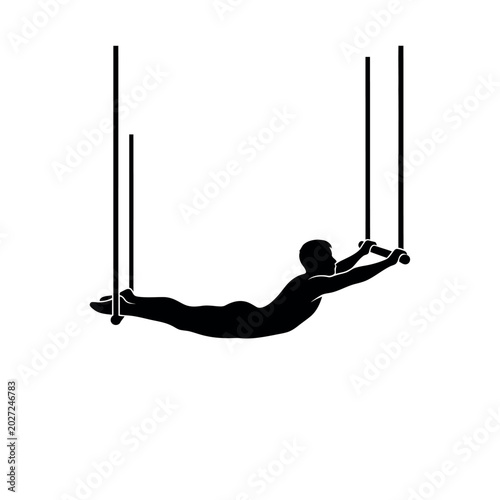 Tableau sur toile Silhouette of a gymnast performing on parallel bars.