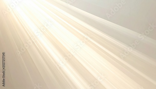 Golden light beams radiate diagonally across a pale, soft background
