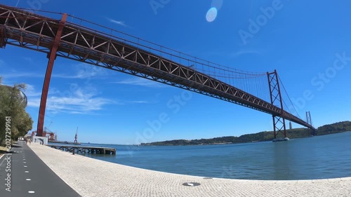 Christ-King and the 25 April Bridge (Ponte 25 de Abril), a steel suspension bridge located in Lisbon, Portugal, crossing the Tagus River (Rio Tejo).