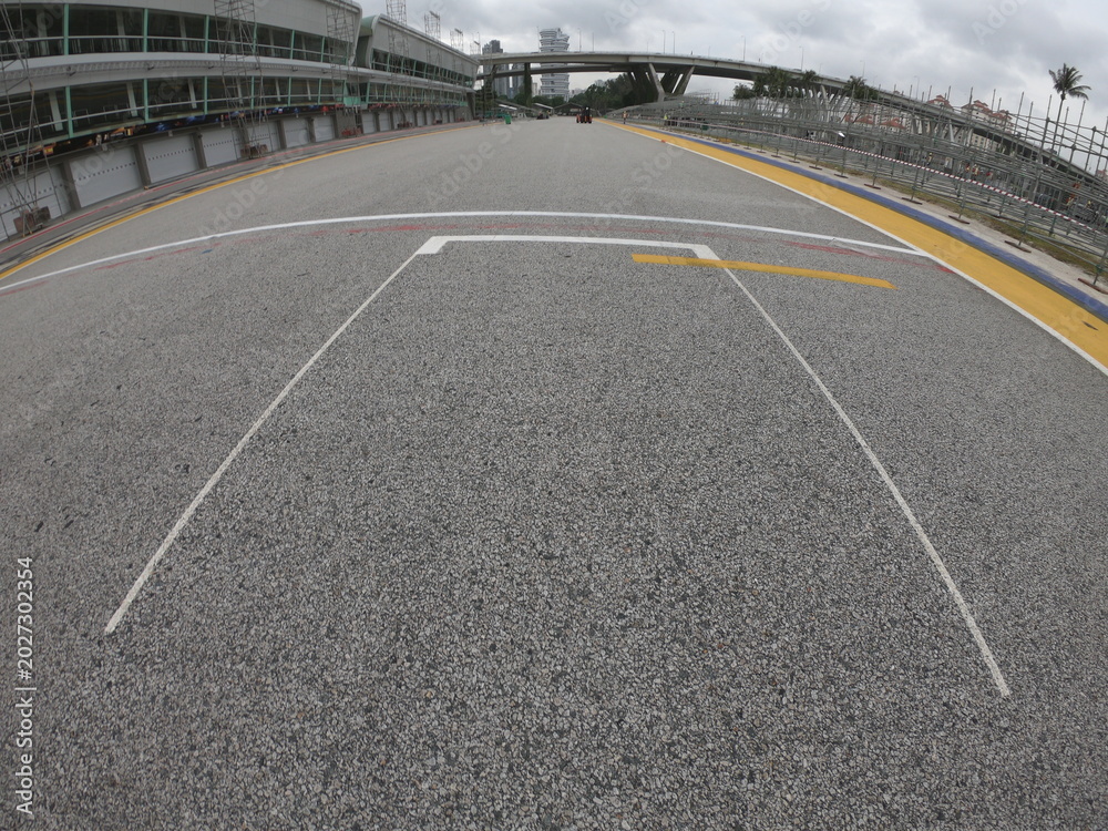 Naklejka premium Singapore / December 2017: Pit lane and start finish line of the Formula One Racing track at Marina Bay Street Circuit. 