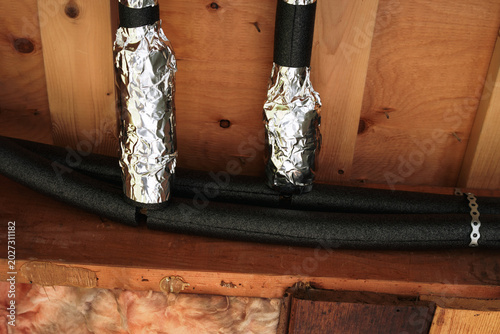 Obraz na płótnie Drain pipes insulated with foam and aluminum foil