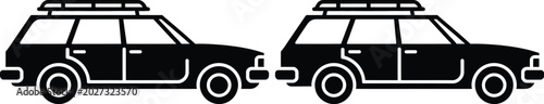 Foto Two black station wagons with roof racks side by side