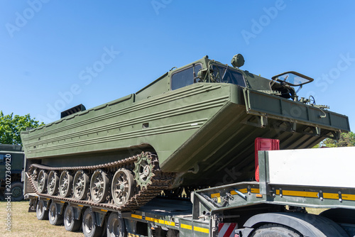 Schilderij op canvas Old soviet military amphibious vehicle on transport trailer