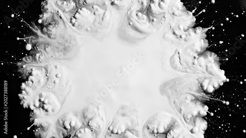 Abstract White Liquid Splash Explosion on Black Background High Speed Photography.