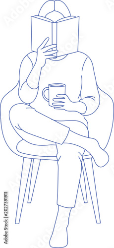 Person reading a book and holding a cup