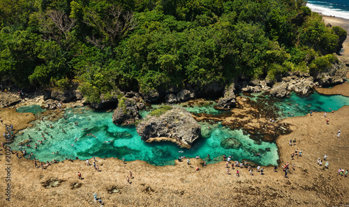 The Magpupungko Rock Pools are a stunning natural wonder in Pilar, Siargao Island, Philippines. Only fully visible during low tide, these tidal pools feature crystal-clear